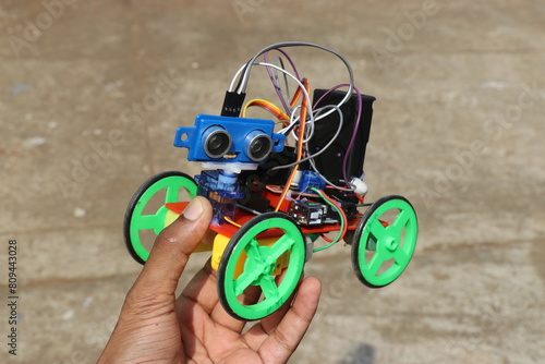 Robotic car project made using 3d printing technology and also the use of different electronic components held in the hand