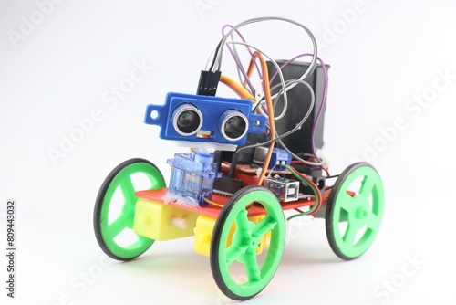 Robotic car made from 3D printed parts and is programmable equipped with ultrasonic sensor for obstacle detection and other electronics