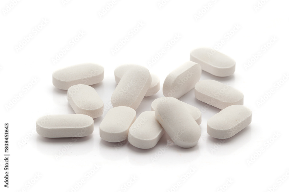 Health care concept. White Medical Pills and Tablets. Isolated on a white background. Front view Health care concept. White Medical Pills and Tablets. Isolated on a white background. Front view