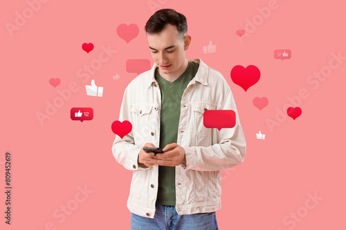 Young man with mobile phone...