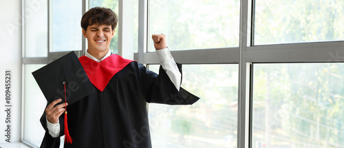 Happy male graduate student...