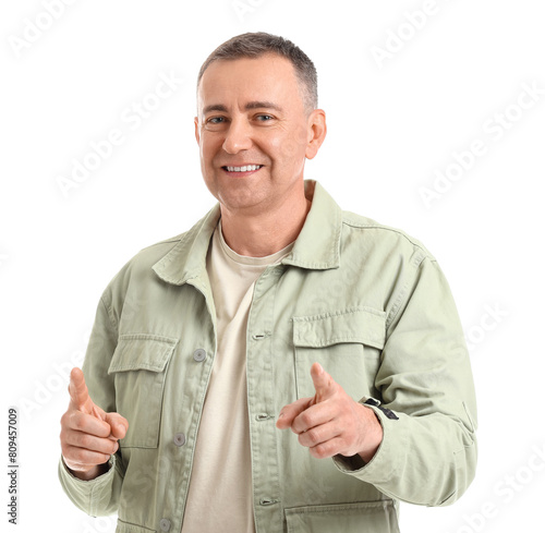 Mature man pointing at view...