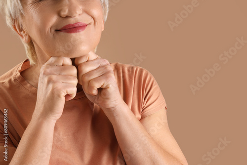 Mature woman doing face bui...