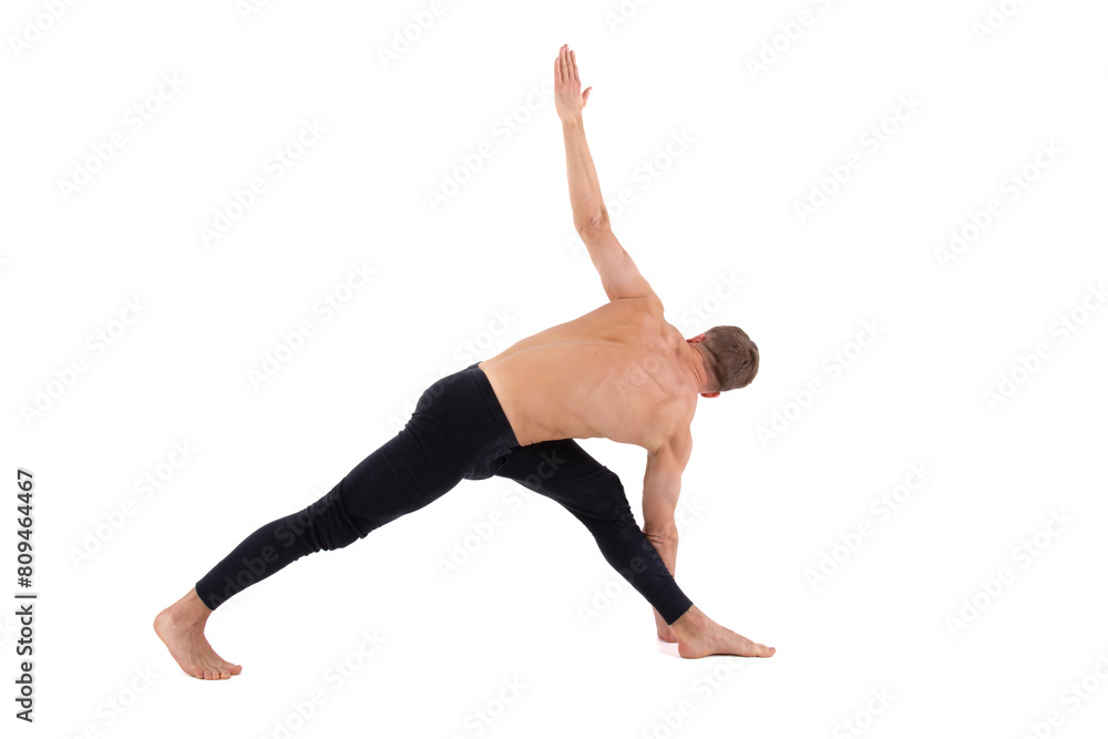 Sports and healthy lifestyle. An attractive man is doing Pilates. White background. Sports and healthy lifestyle. An attractive man is doing Pilates. White background.