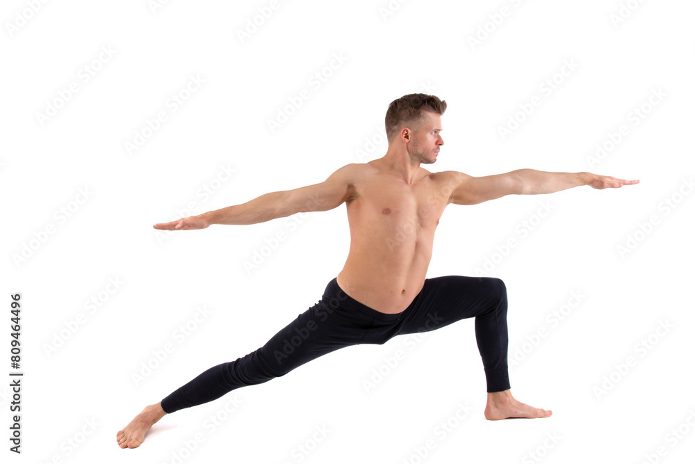 Sports and healthy lifestyle. An attractive man is doing Pilates. White background.