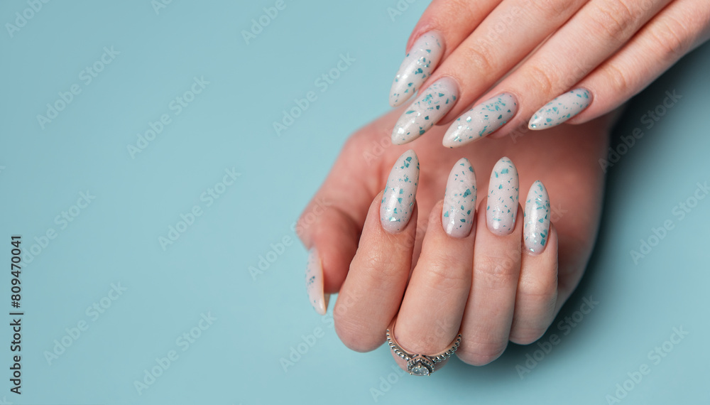 Female hands with blue nail design. Blue nail polish manicure. Female hands with blue nail design. Blue nail polish manicure.