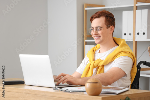Young man in wheelchair wor...