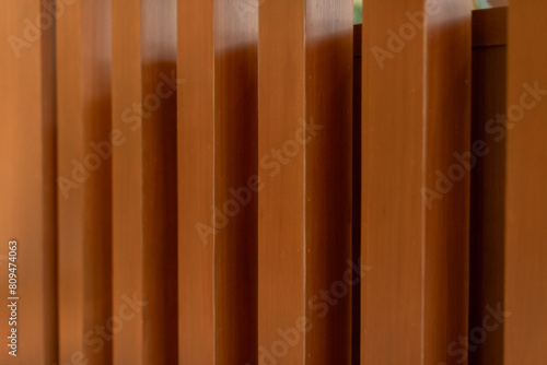 Texture of vertical wooden lath wall background.