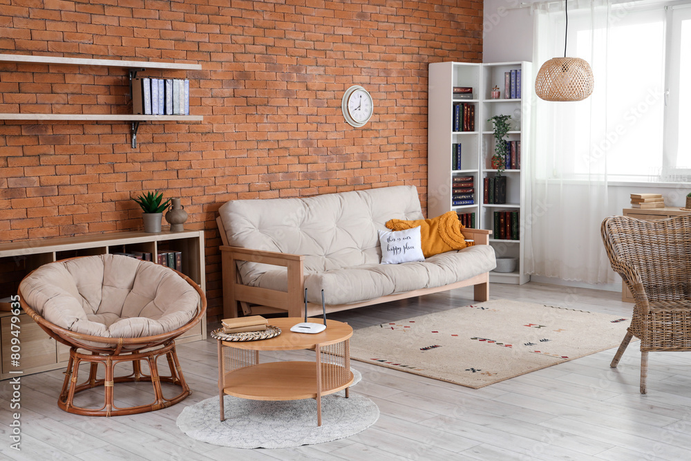 Interior of living room with sofa, bookshelves and wi-fi router on ...