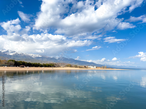 Sunny summer day on the lake. Mountains and sea. Kyrgyzstan, Lake Issyk-Kul