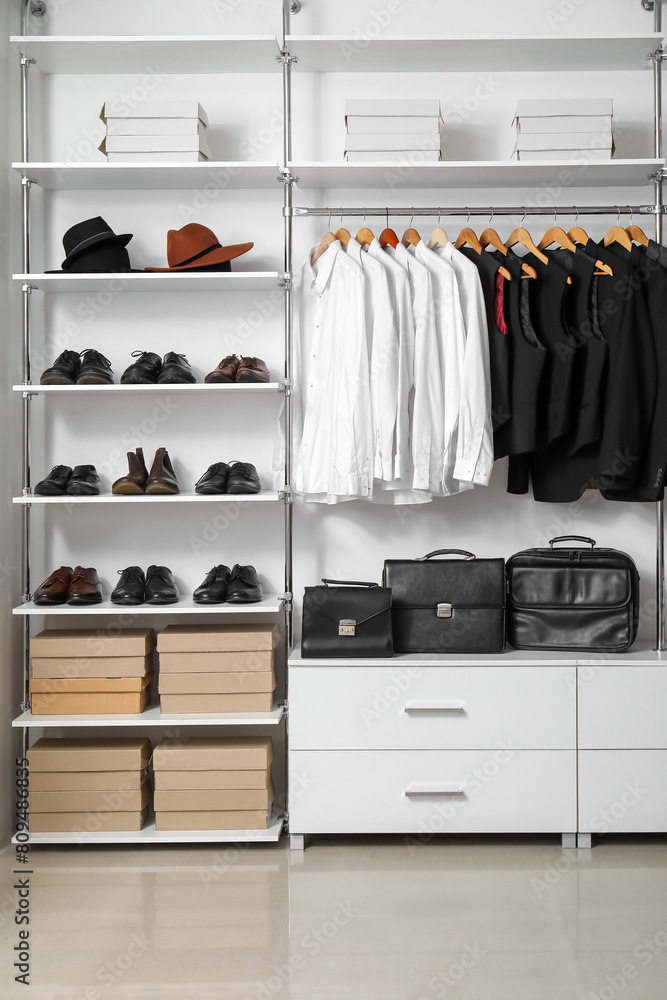 Rack with clothes and shoes in modern man's wardrobe Rack with clothes and shoes in modern man's wardrobe