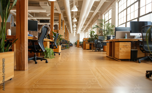 Office designed with sustainable architecture features such as bamboo flooring, LED lighting, and ergonomic furniture made from recycled materials. 