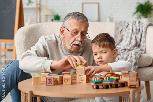 Grandfather playing with hi...