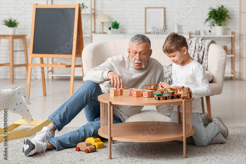 Grandfather playing with hi...