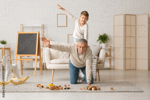 Grandfather with his cute l...