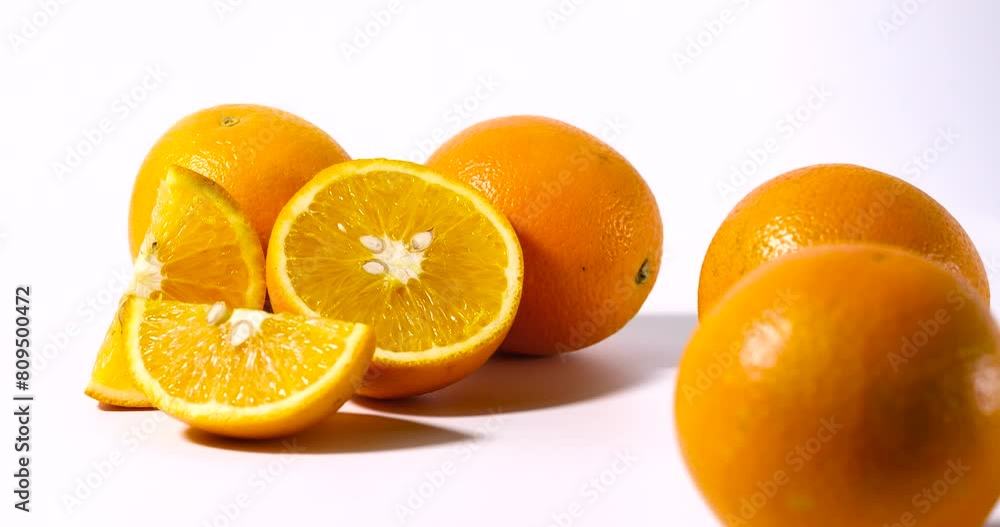 Shift focus shot of fresh orange fruit on white background.