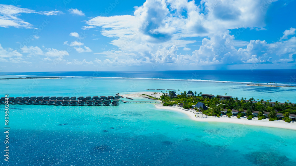The Tropical aerial view with maldives paradise scenery seascape with water villas as amazing sea and lagoon beach, Exotic tourism The Tropical aerial view with maldives paradise scenery seascape with water villas as amazing sea and lagoon beach, Exotic tourism