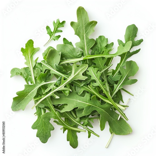 Arugula is a leafy green vegetable that is often used in salads. It has a slightly bitter taste and a peppery aroma. Arugula is a good source of vitamins A, C, and K. photo
