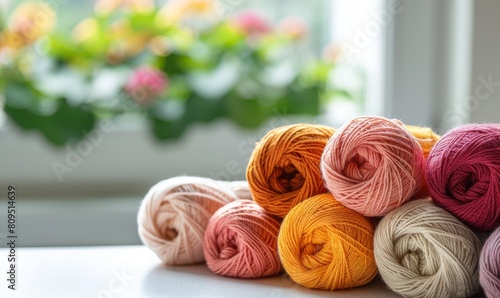 needlework - warm colored cotton yarn balls
