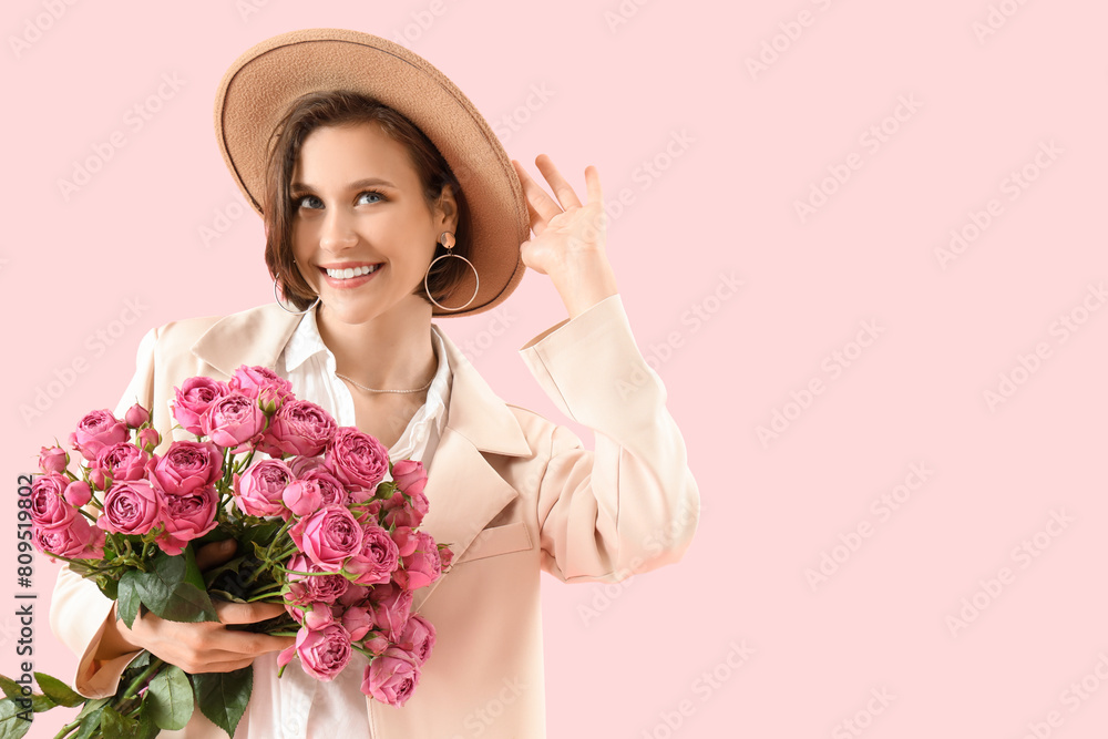 Beautiful young woman with roses on pink background Beautiful young woman with roses on pink background