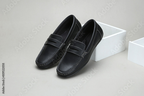 фотографія black leather loafers slip on shoes isolated