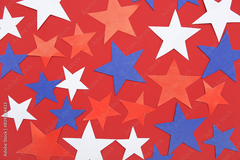 Stars in colors of USA flag on red background. American Independence Day celebration Stars in colors of USA flag on red background. American Independence Day celebration
