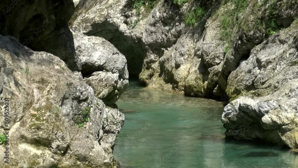 crystal clear Tolminka river in gorge in triglav national park, slovenia, static shot