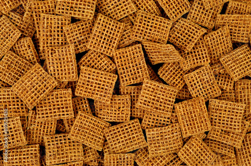 Group of weaved wholegrain wheat breakfast cereal background