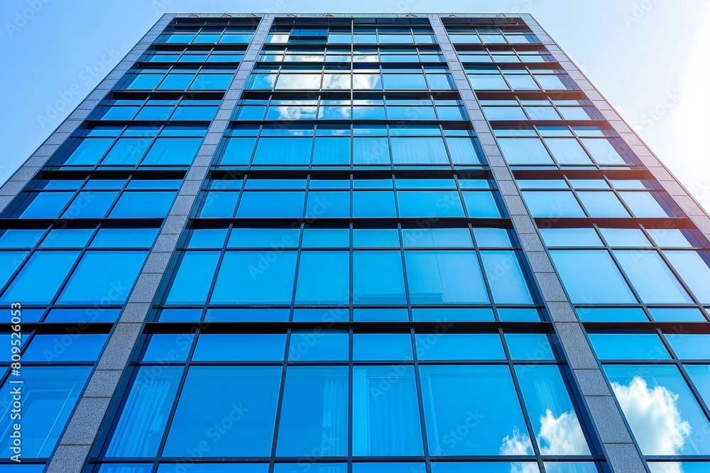Contemporary architectural masterpiece with blue triangular glass panels and concrete elements Contemporary architectural masterpiece with blue triangular glass panels and concrete elements