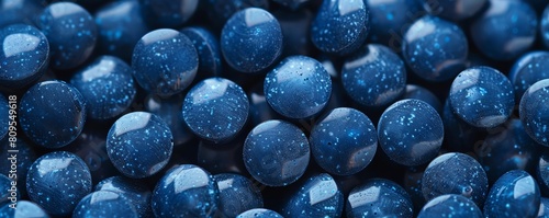 A detailed illustration of nuclear fuel pellets, showcasing their glossy, ceramiclike texture and deep blue color in a welllit laboratory setting