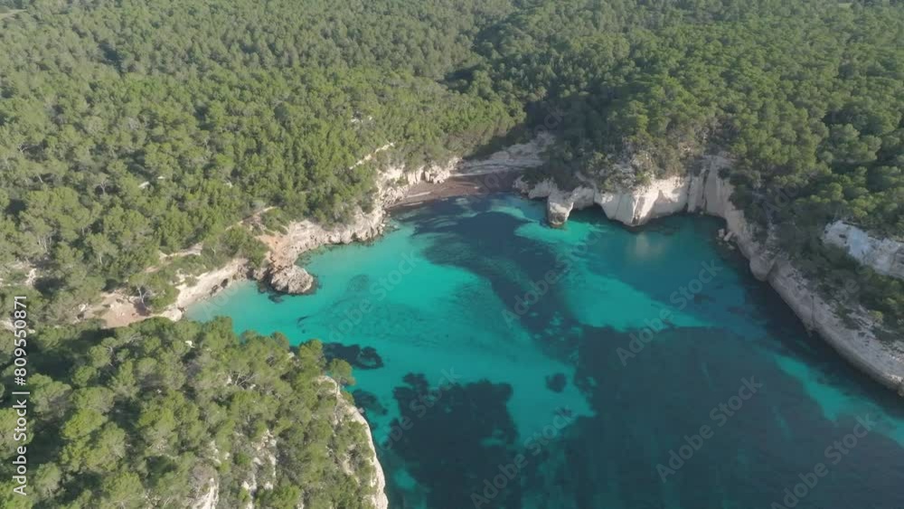 Aerial green coastal turquoise hidden Beach bay in Menorca Spain, Cala Mitjana Aerial green coastal turquoise hidden Beach bay in Menorca Spain, Cala Mitjana