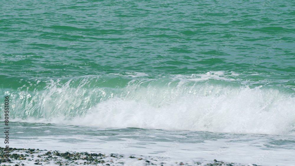 Turquoise Waves With Clear Water Surface Background. Beautiful Turquiose Sea Waves Breaking. Slow motion.