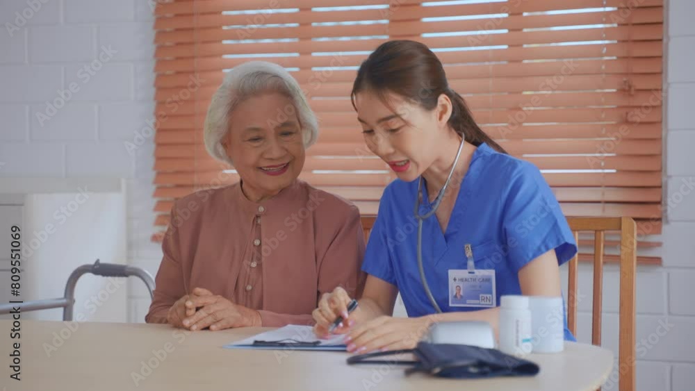 Asian young caregiver nurse examine senior woman patient at home. Asian young caregiver nurse examine senior woman patient at home.