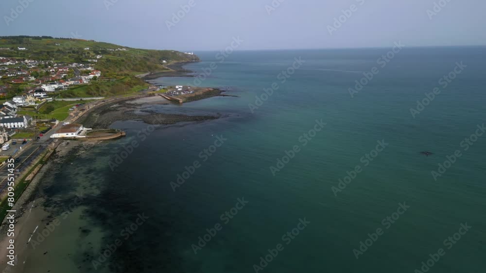 Aerial shot of Whitehead, a seaside village in Co. Antrim, Northern Ireland.
The camera moves left, to reveal the blue sea.
Produced in 4K, 60 frames per second and in Rec709 color space. Aerial shot of Whitehead, a seaside village in Co. Antrim, Northern Ireland.
The camera moves left, to reveal the blue sea.
Produced in 4K, 60 frames per second and in Rec709 color space.