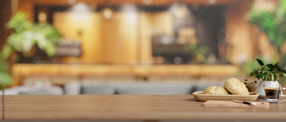 A copy space on a wooden tabletop features a bread basket and a coffee cup in a modern restaurant. A copy space on a wooden tabletop features a bread basket and a coffee cup in a modern restaurant.