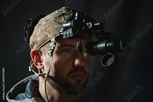 A military man with night vision device on his head.