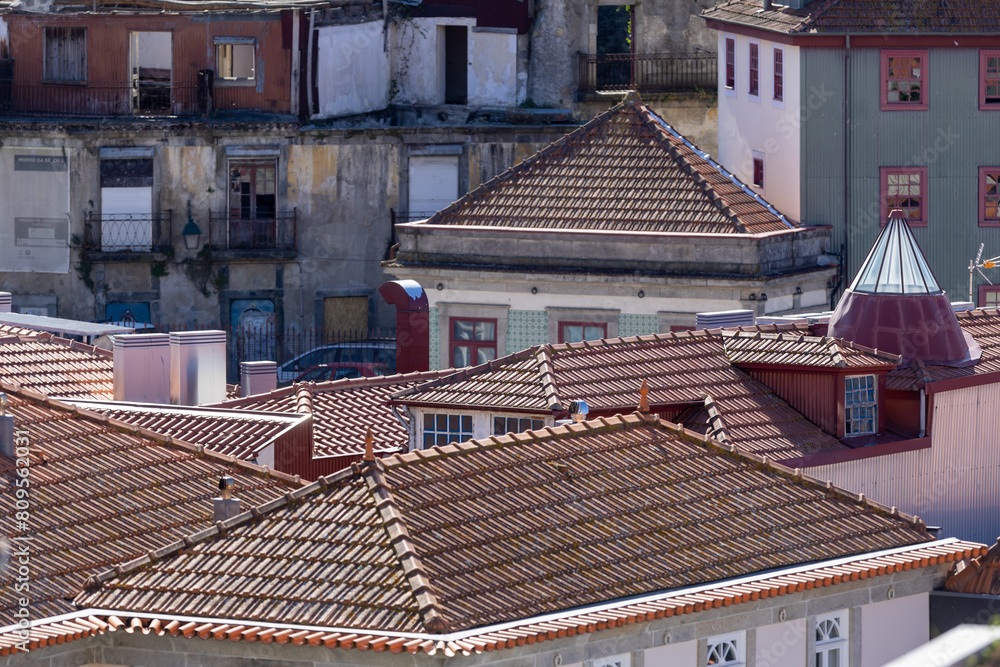 View from above of tiled roofs of the old town of Porto, Portugal. View from above of tiled roofs of the old town of Porto, Portugal.