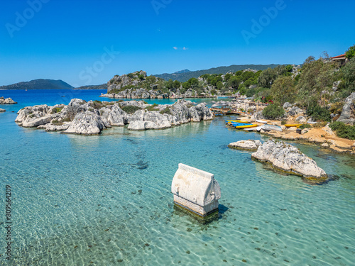 The ancient city of Simana, founded by the Lycian civilization, the sunken city of Kekova, rock tombs, castle, sea and nature reveal its magnificence. photo