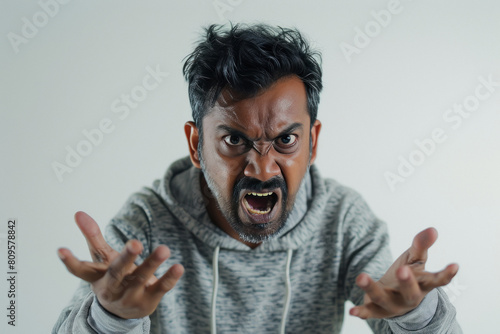 Indian man wearing sweatshirt and he is very angry