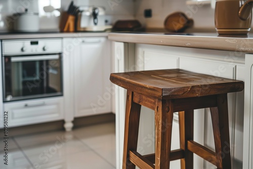 Environment focused on the stool, high wooden stool in the kitchen photo