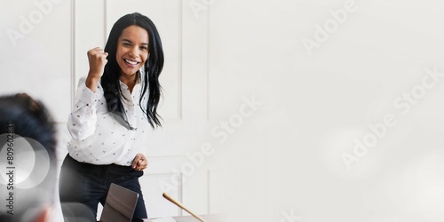 Fotografie Businesswoman motivating her team members in a meeting
