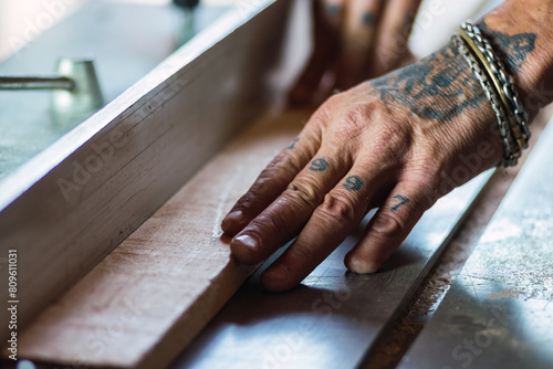 Close up shot of old master carpenter working in his woodwork or workshop