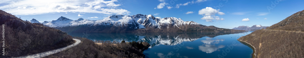 Panoramic drone view of Holandsfjord and Nordfjord in Nordland county. In the background is the Svartisen glacier, Norway's second largest glacier