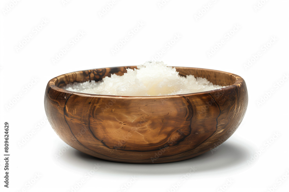 a wooden bowl filled with white sugar a wooden bowl filled with white sugar