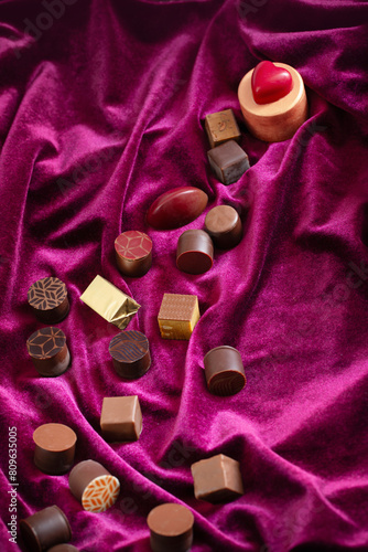 cchocolate candy on purple velvet  textile