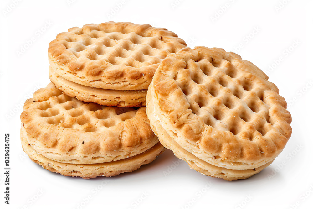 a stack of three waffle cookies on a white surface a stack of three waffle cookies on a white surface