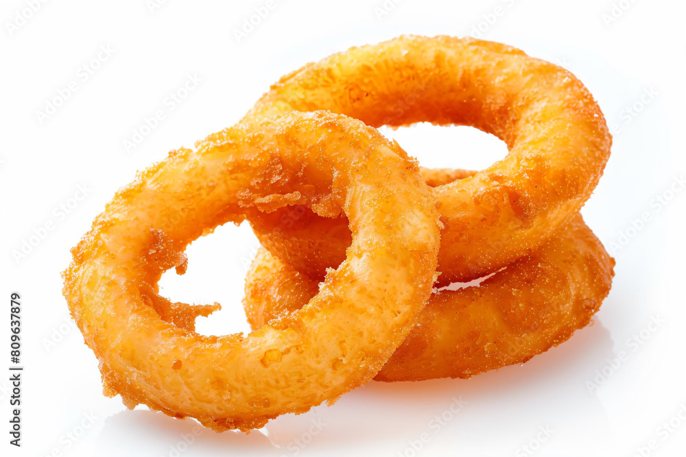 a pile of onion rings on a white surface a pile of onion rings on a white surface