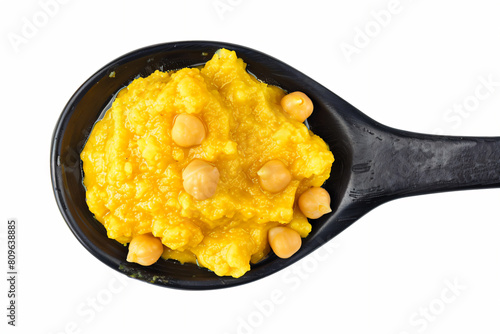 a spoon with a scoop of hummusle and chickpeas photo
