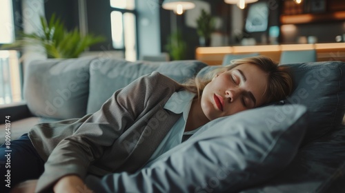 An exhausted businesswoman slept on her couch at work