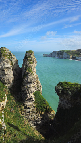 Cliffs  landscape along the Falaise d Aval  view of the La Manche. Etretat  Normandy  France  English Channel. Natural rocks  coast. Rocks of the village of Etretat in spring in cloudy weather